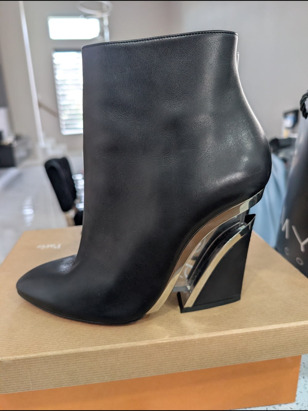 Black Women's Leather Ankle Boot with Sculpted Metallic Heel